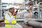 Worker using walkie talkie on site