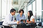 Business people working together in cafe