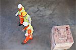 Workers walking at construction site