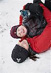 Mother and son playing in snow