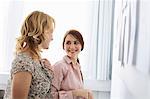 Businesswomen smiling in office