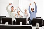 Business people cheering in headsets