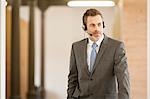 Businessman wearing headset in office