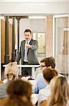 Businessman hosting seminar in office