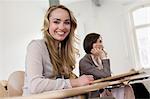 Businesswoman smiling at desk