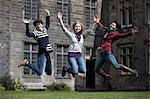 Students jumping for joy outdoors