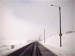 Street lights in snowy landscape