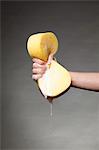 Hand squeezing soapy sponge