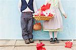 Children with baskets of paper flowers