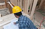 Carpenter reviewing house plans