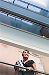 Businesswoman in the atrium of office building