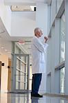 Doctor lost in thoughts at hospital window