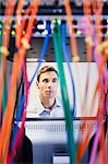 Young man in server room