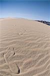 Footprints in sand dune in Death Valley National Park, California, USA