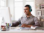 Young man working on computer in office