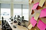 Sticky notes on wall in empty office