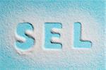 The word "sel" written with salt