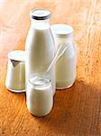 Yoghurts in glass pots,milk in glass bottle