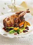 Roast partridge with plum sauce and vegetables