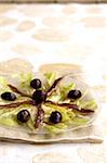 Fennel Carpaccio with anchovies and black olives