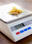 Weighing crystallized fruit on scales