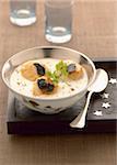 Cream of cauliflower soup with scallops and truffles