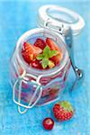 Open jar of summer fruit