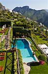 Italy, Ravello, Terrace with outdoor pool and couple kissing