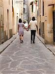 Italy, Florence, Young couple walking in old town
