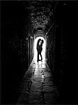 Italy, Venice, Young couple kissing in archway