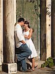 Italy, Ravello, Mature couple standing by old weathered door