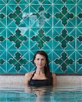 Italy, Amalfi Coast, Ravello, Portrait of mature woman in swimming pool