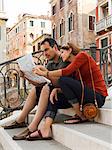 Italy, Venice, Mature couple on vacations studying city map