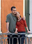 Italy, Venice, Mature couple standing on balcony