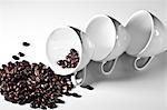 Studio shot of coffee cups and spilling coffee beans