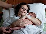 USA, Utah, Payson, Mother embracing newborn baby