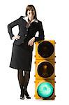businessperson holding a traffic signal