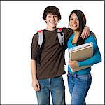 Students with book bags posing