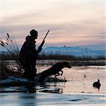 man and his dog duck hunting