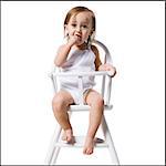 baby girl in a high chair