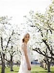 woman in a blossoming orchard