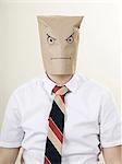 businessman with a brown paper bag over his head
