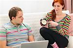 Red hair young woman hinting to boyfriend it's time to spend time with her