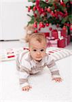 Baby girl crawling on the floor - where is the christmas tree mom  ?