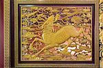 Gold Gilt Wood Carving of Qilin on Chinese Temple Wall in Chinatown