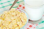 Cornflakes and milk on the table