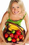 woman holds a basket of fruit on a white background