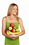woman holds a pile of fruit on a white background