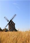 Windmill in a wheat field.Selective focus in the distance on the windmill.The mill is Frouville Pensier in the Eure and Loir region of France.