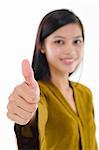 Young Asian female giving thumb up sign.